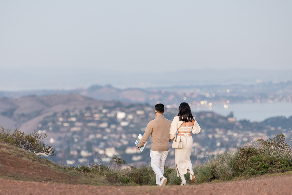 couple walking off into the distance with cityscape background