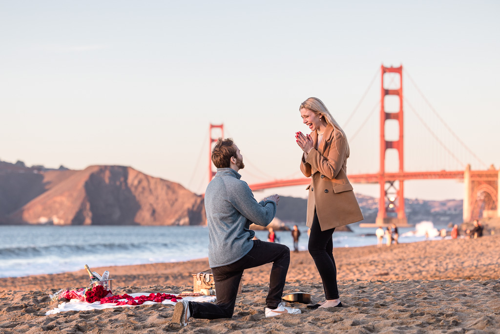 Baker Beach picnic surprise proposal with the Golden Gate Bridge background