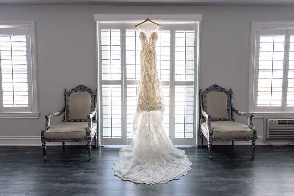bride’s dress hanging up inside Willow Heights Mansion getting ready space