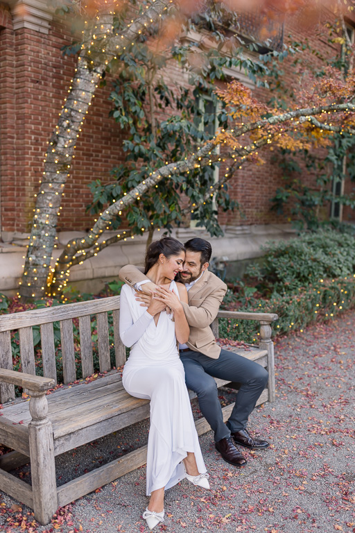 engagement photos on a bench at Filoli Gardens during the autumn