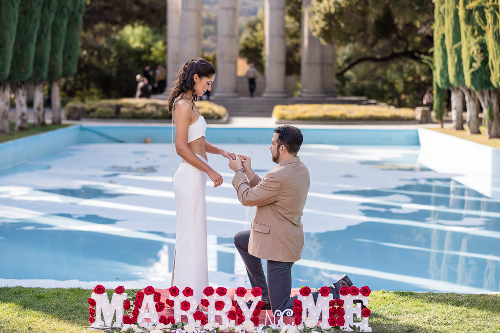 Pulgas Water Temple pool marriage proposal with marry me sign and roses