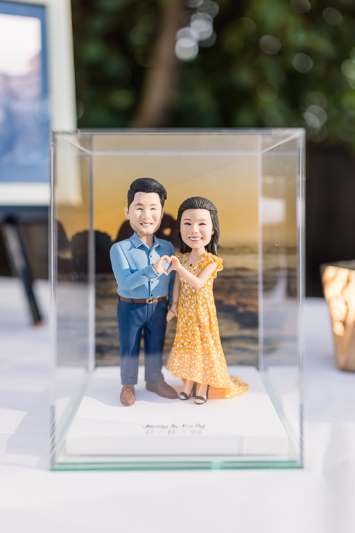 figurines of bride and groom modeled after their engagement photos