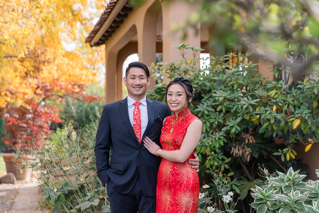 bride and groom dressed in traditional Chinese red attire