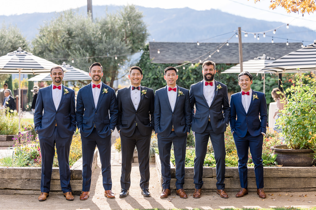 posed photo of groom with groomsmen at The Garden Grove at Tre Posti