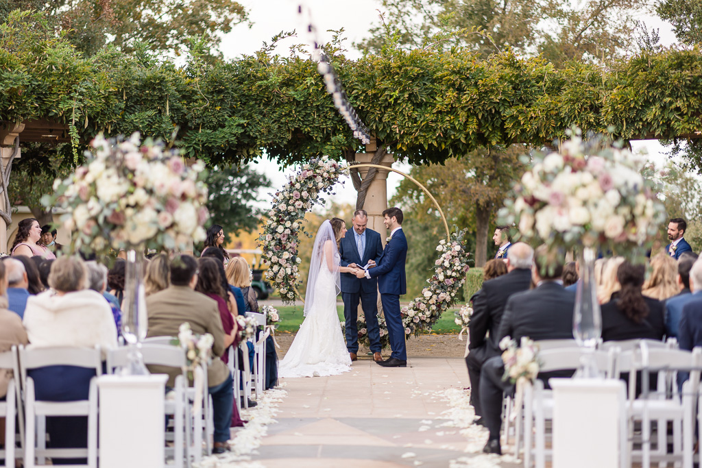 The Club at Ruby Hill wedding ceremony with circular floral arbor