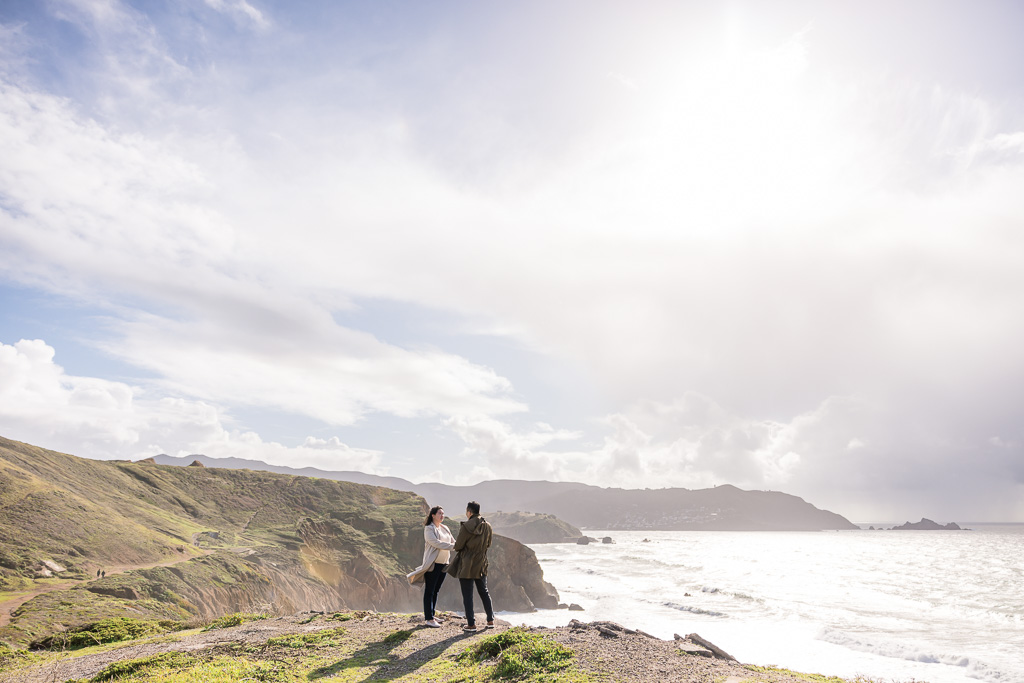 wide angle shot of couple standing on top of Mori Point
