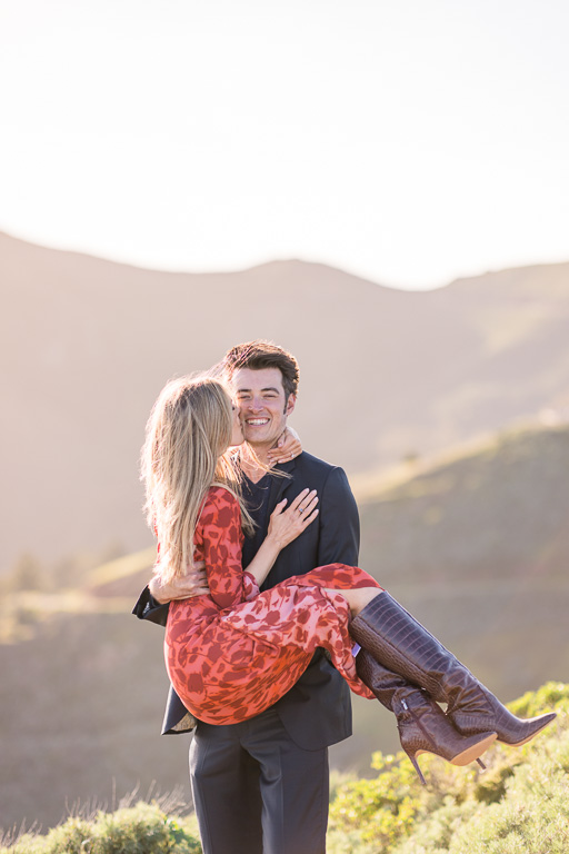 soft light engagement photos with rolling hills in the background