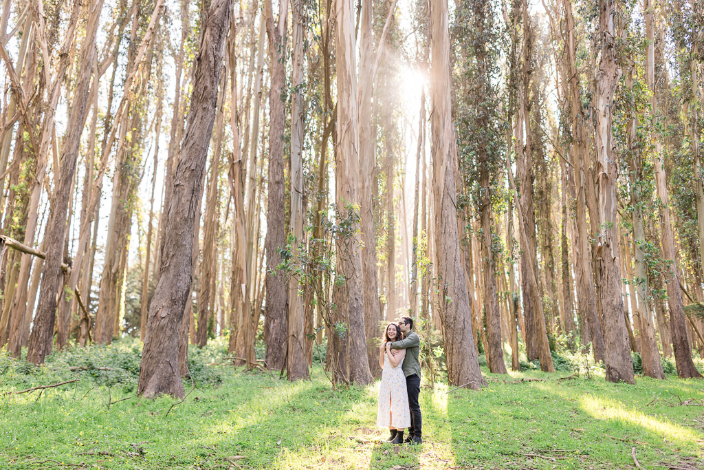 forest engagement photos with golden light and god rays shining down