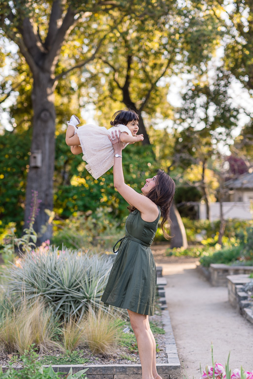mommy lifting baby up into the air like superman