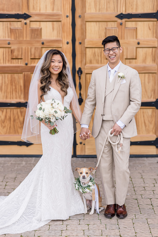 family photo of the newlyweds and their puppy