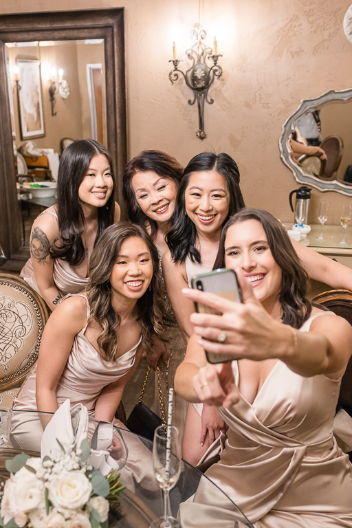 bridesmaids taking a group selfie