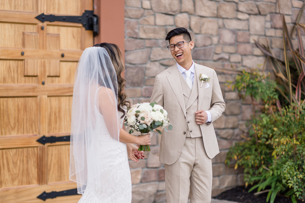 groom could not stop smiling when he saw her for the first time on their wedding day