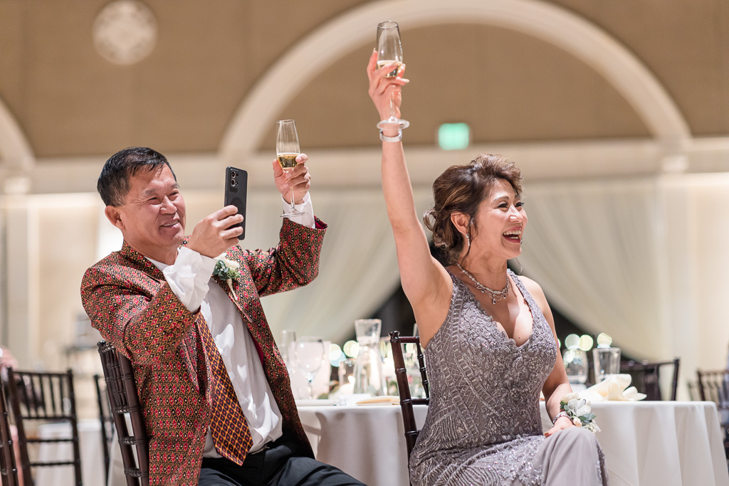 parents toasting to the newlyweds