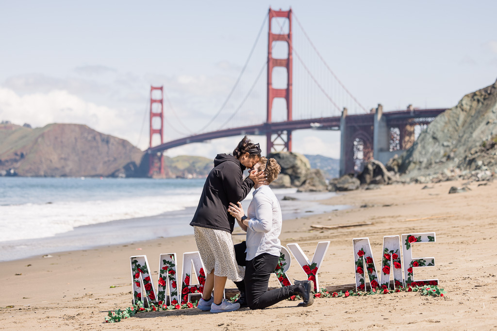 giant marry me letters and flowers for surprise proposal