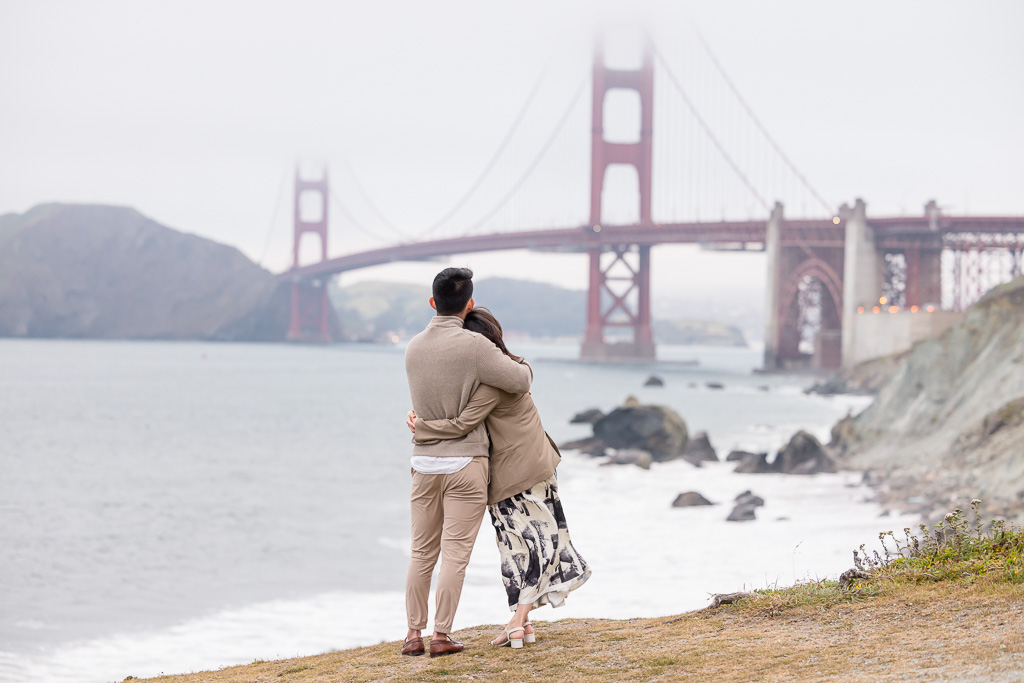 couple sharing a moment together in front of the Golden Gate Bridge