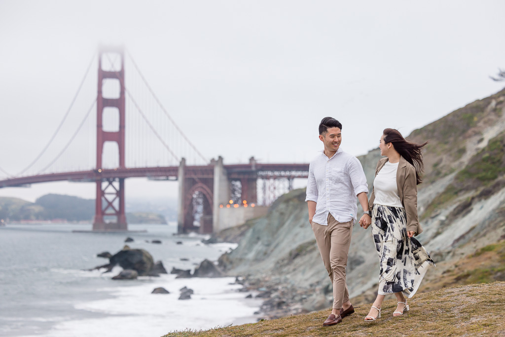 engagement photos on ocean bluffs at the Golden Gate Bridge