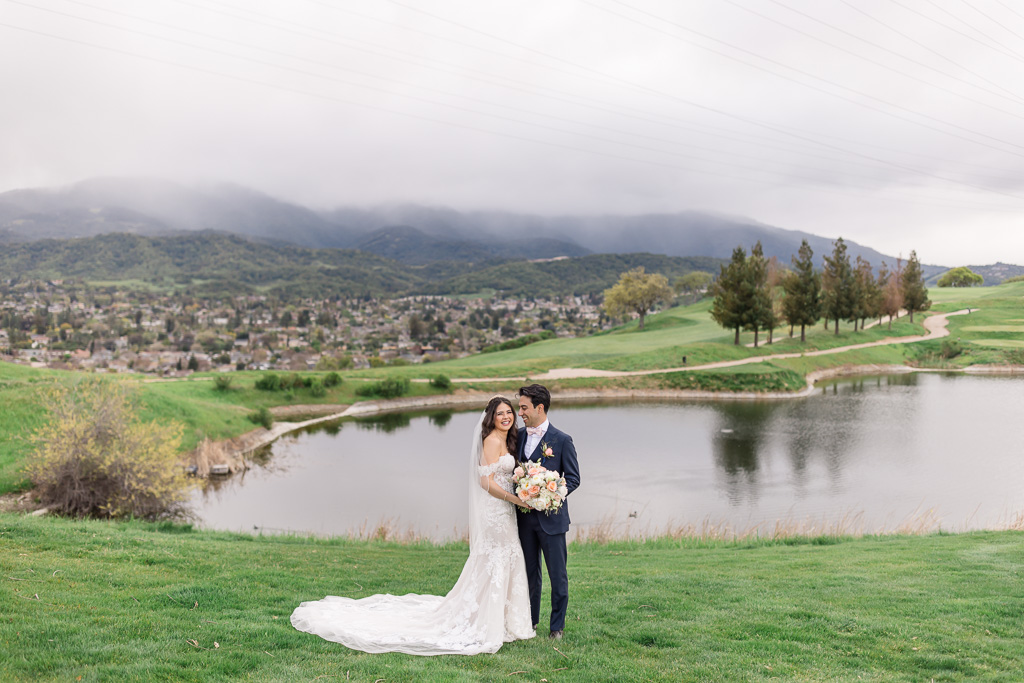 golf course wedding photo in front of a pond at Boulder Ridge Golf Club