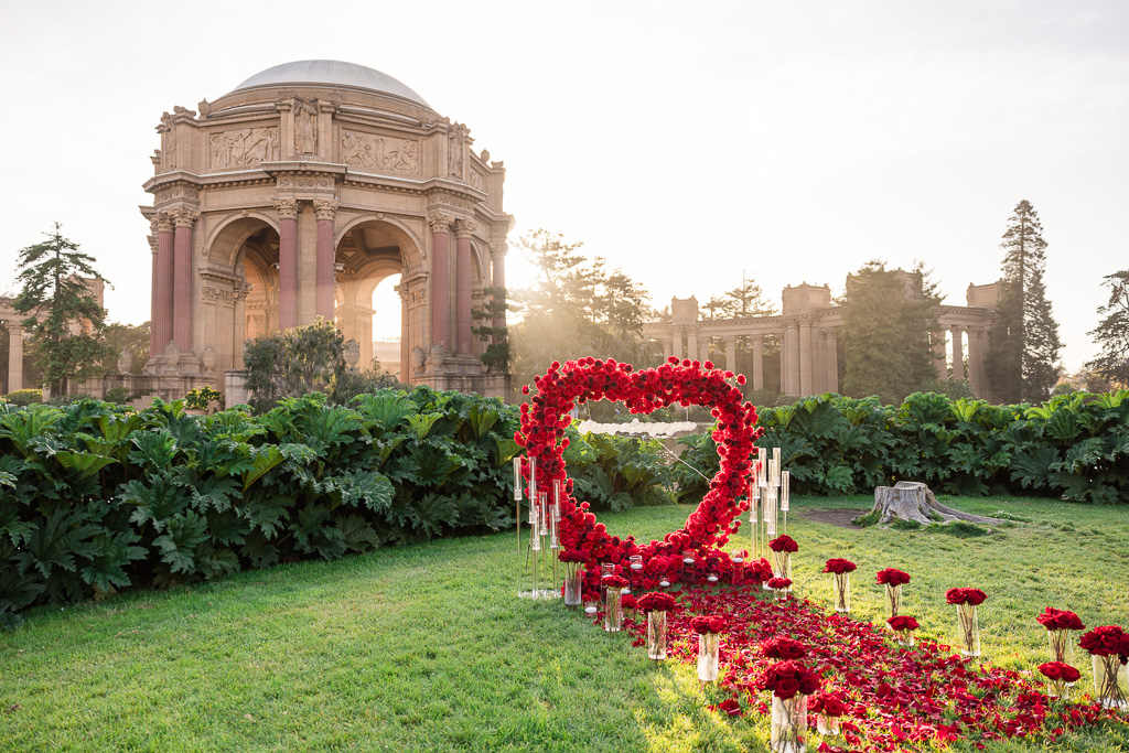 elaborate heart-shaped rose arch surprise proposal decor