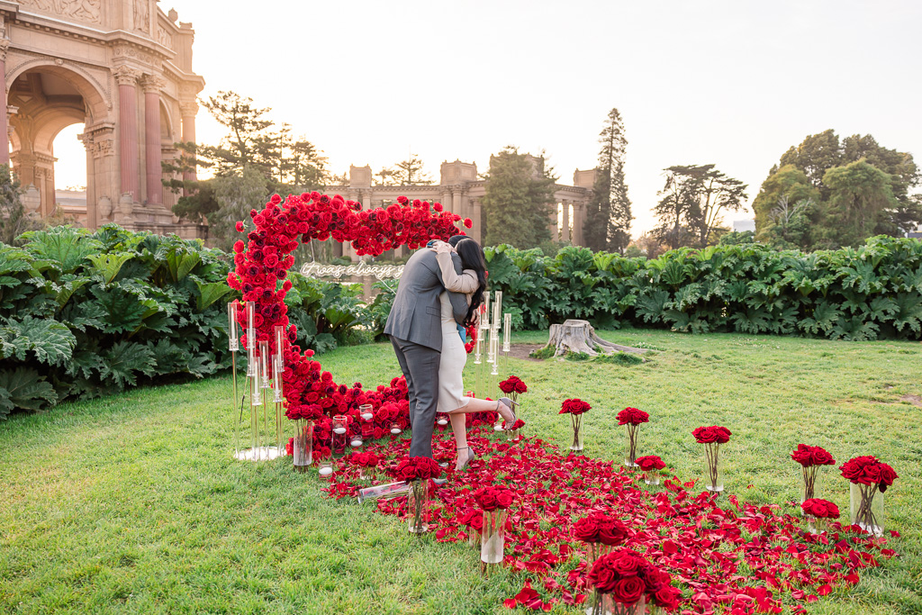 surprise proposal at an elaborate rose heart decor