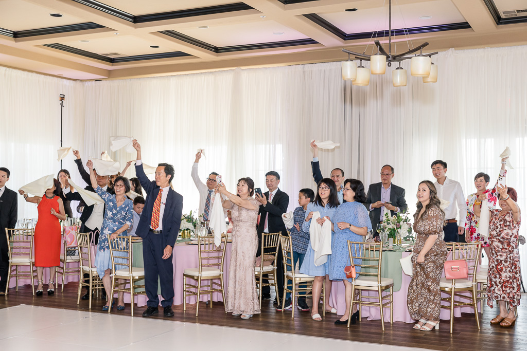 guests cheering for bride and groom to enter