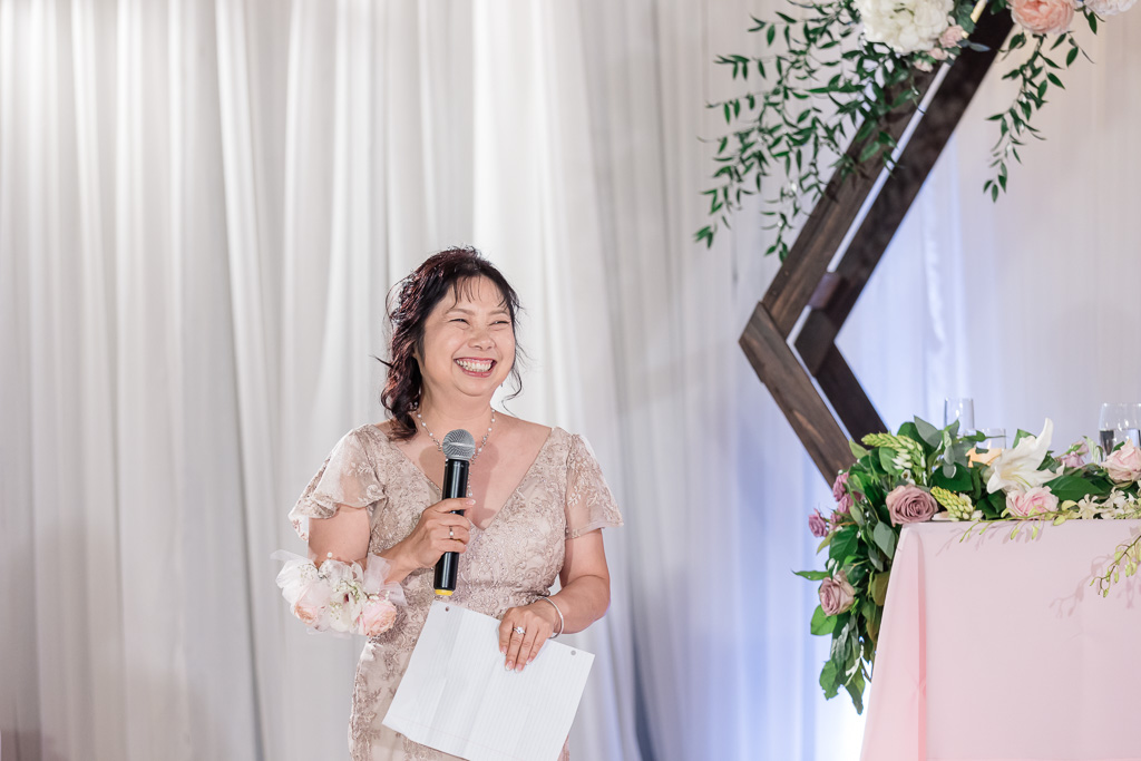 mother of the bride giving a very happy speech