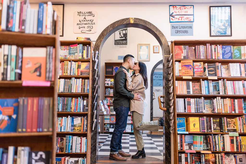 cute couple engagement shoot in a bookstore