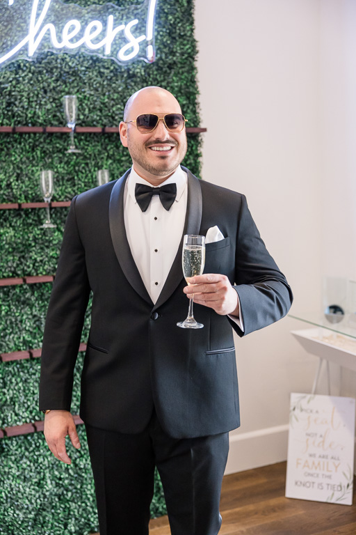 groom having a glass of champagne