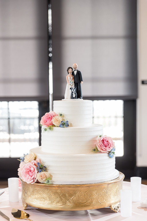 wedding cake with cute topper