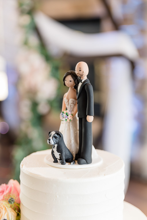 bride, groom, and dog wedding cake topper