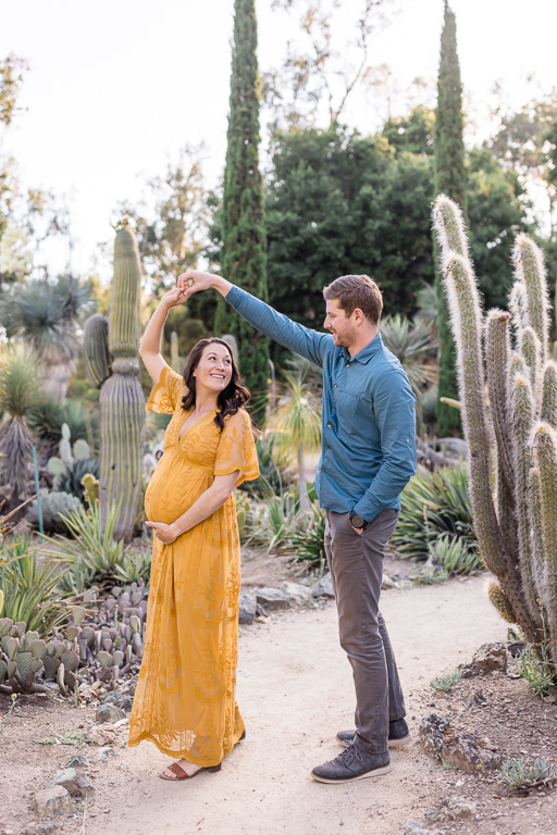 casual candid maternity photos at the Arizona Cactus Garden