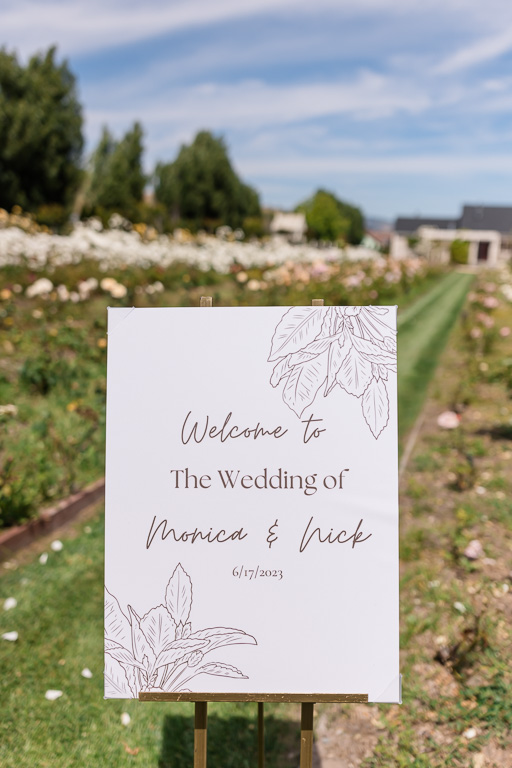outdoor wedding welcome sign on wooden easel