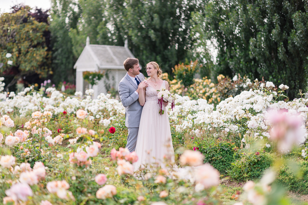 romantic colorful outdoor garden portrait of the bride and groom