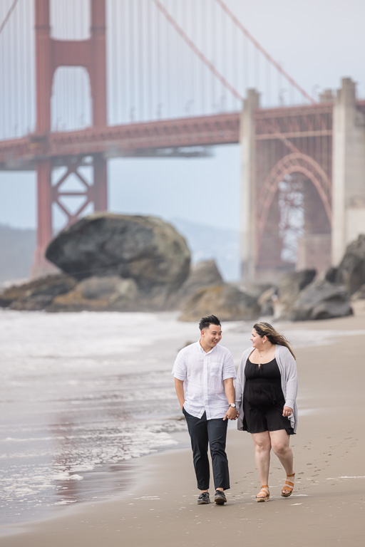 Golden Gate Bridge beach couple walking