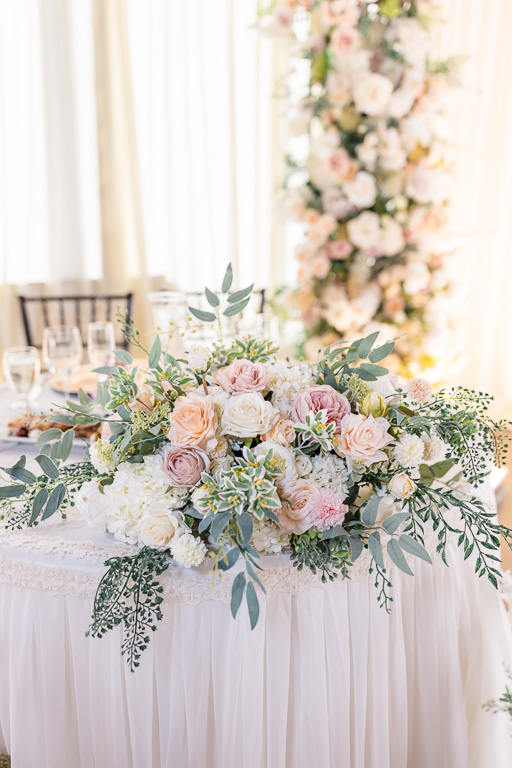 floral decor on sweetheart table