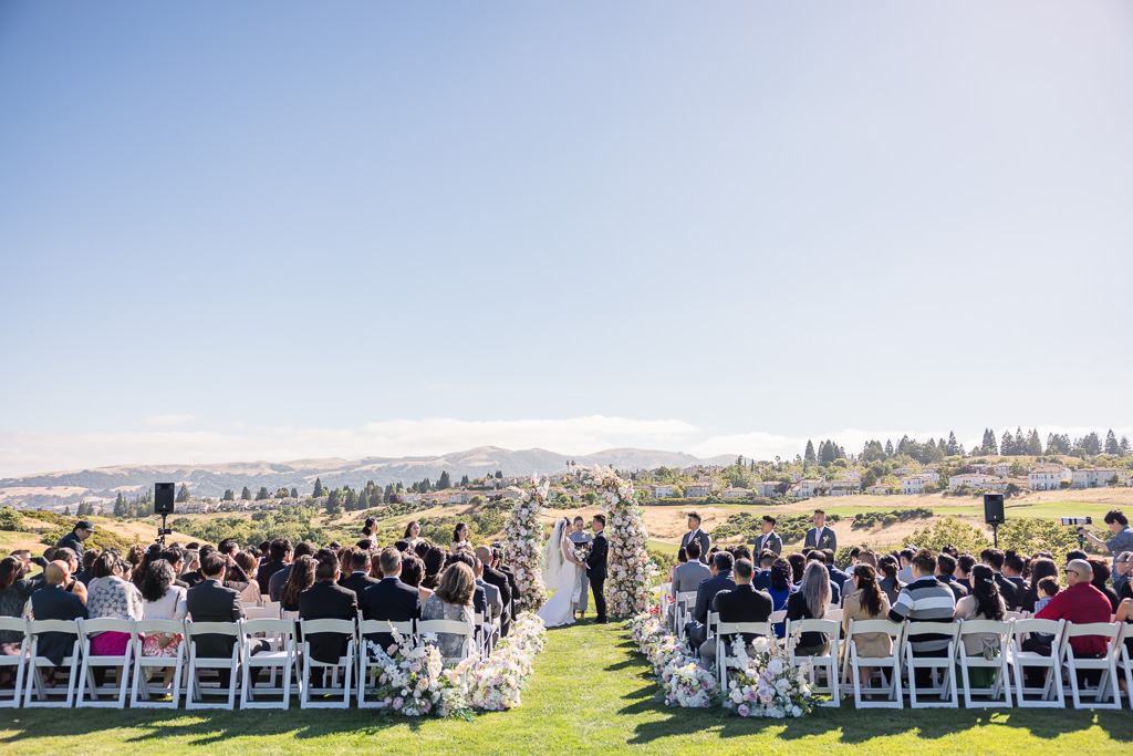 wide-angle view of wedding ceremony at The Bridges Golf Club in San Ramon
