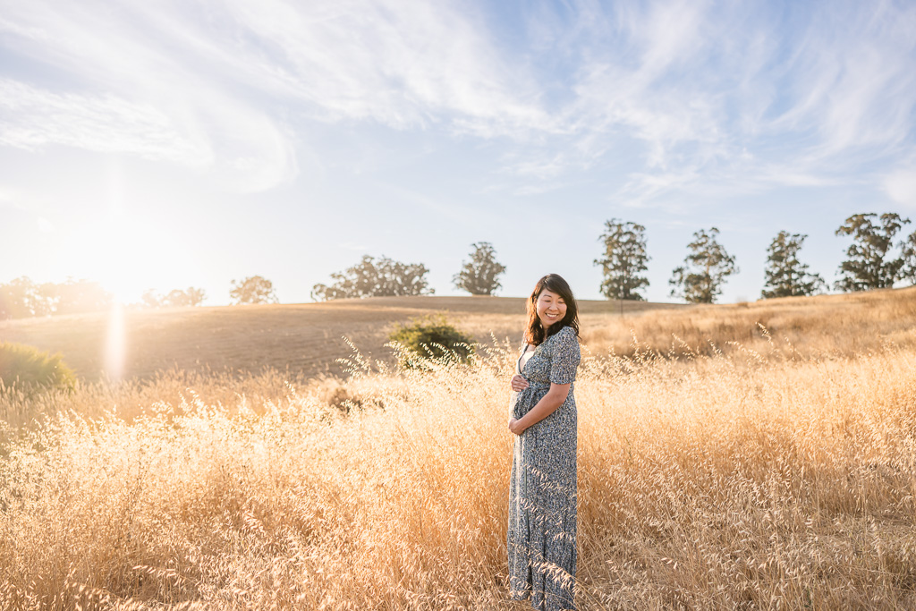 maternity shoot at a golden grassy field
