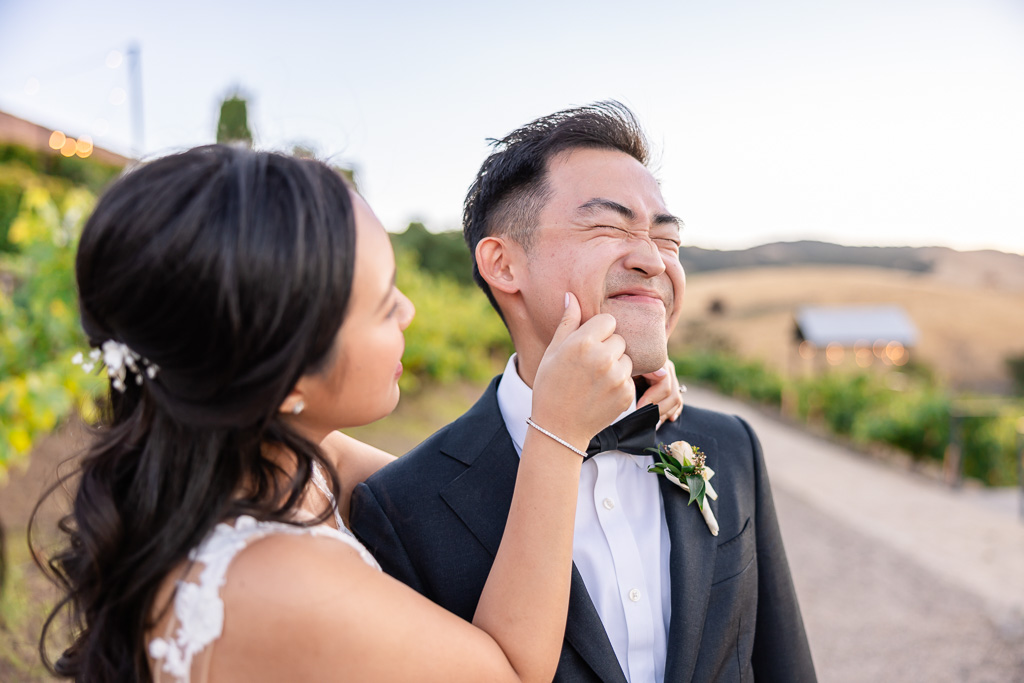 bride pinching groom's cheek