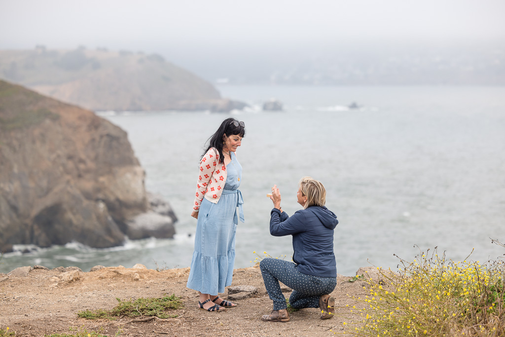 same-sex surprise proposal on an ocean cliff in Pacifica