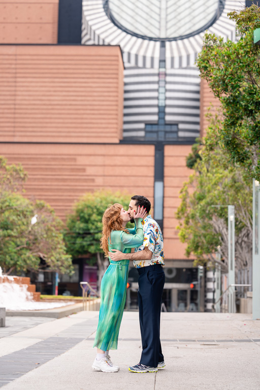 kissing in front of SFMOMA