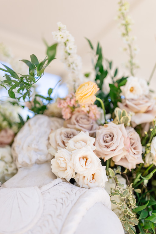 wedding floral on marble statue