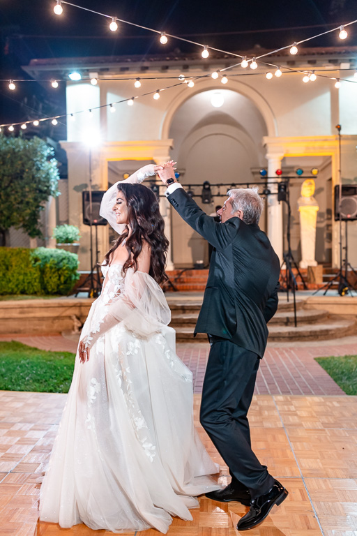 father twirls the bride
