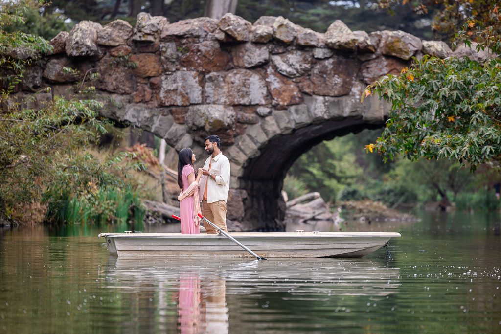 putting on engagement ring on a rowboat