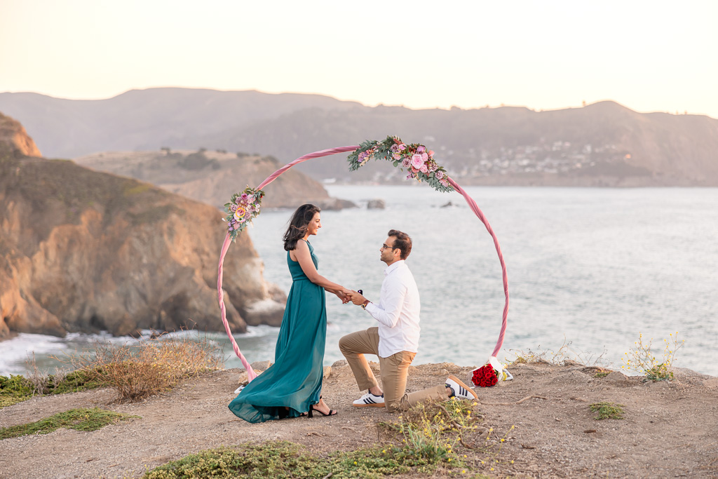 Pacifica oceanside surprise proposal with circular arch background