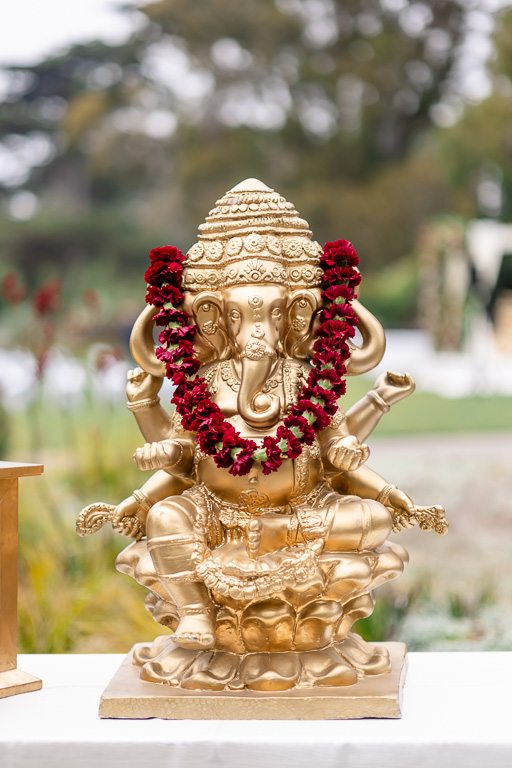 golden Ganesh statue at wedding