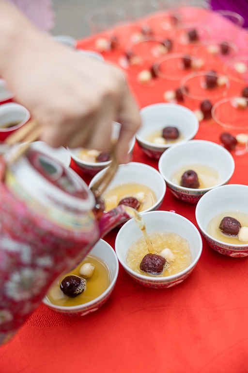pouring tea into teacups for tea ceremony