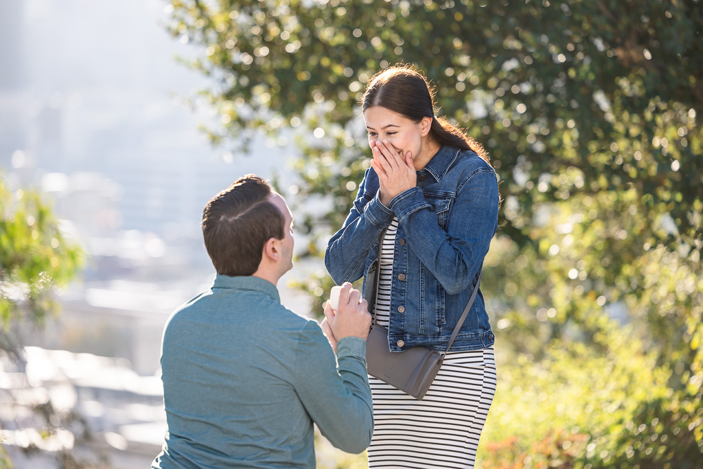 paparazzi-style hidden photographer surprise proposal photo