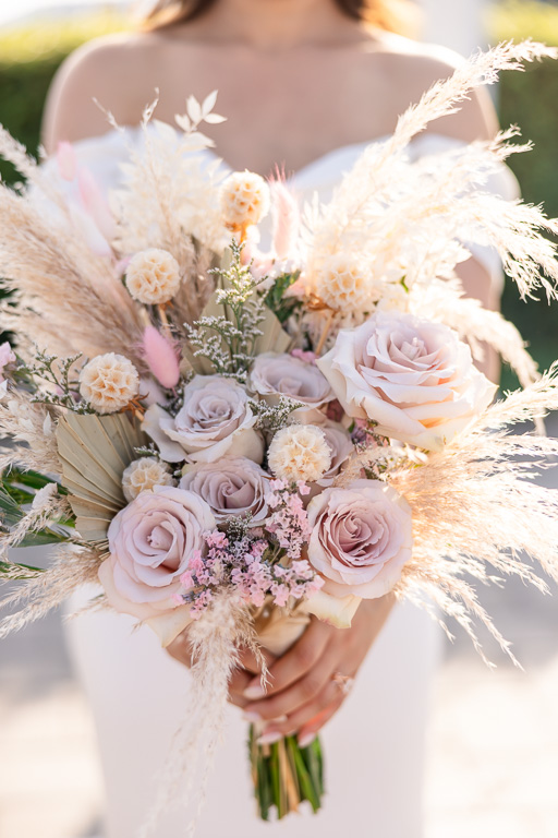 bride's bouquet with dry feather grass and muted flowers