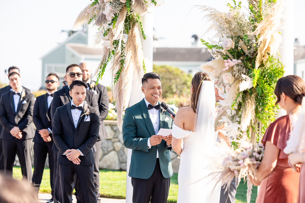 groom reading personal vows during Oceano wedding ceremony