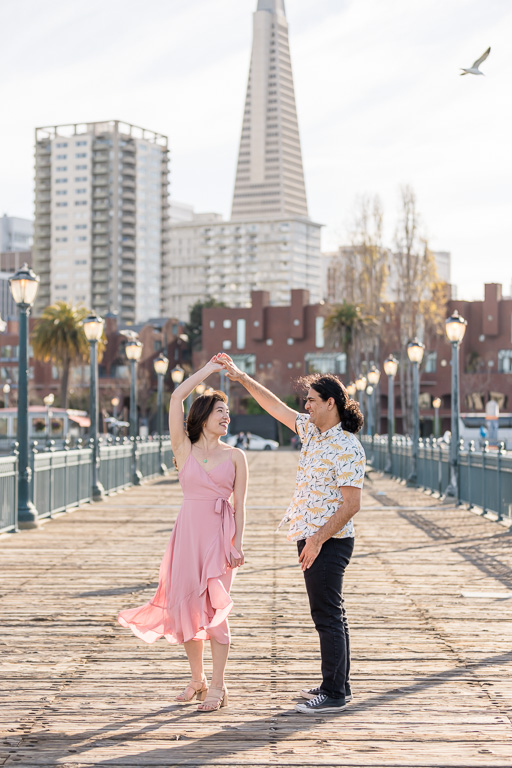dancing on Pier 7 in SF with downtown backdrop