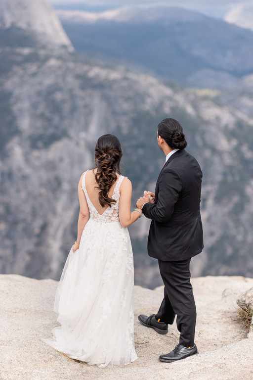 couple standing on top of a mountain